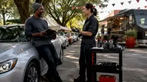 Driver and technician discussing no appointment oil change