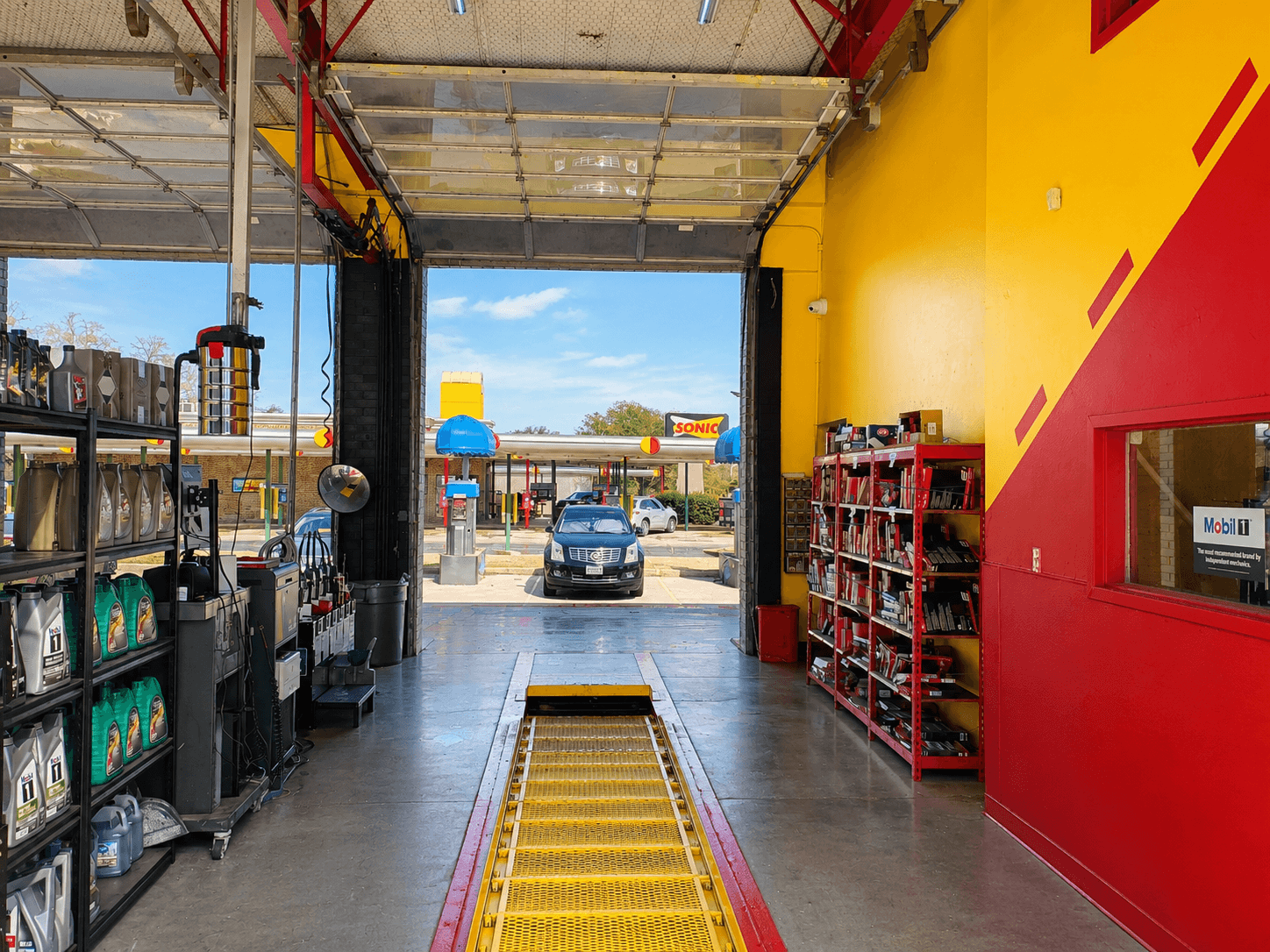 Inside Express Lube & Car Care in Plano, TX featuring a clean professional auto repair service bay