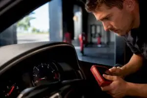 Technician observing low engine idle RPM