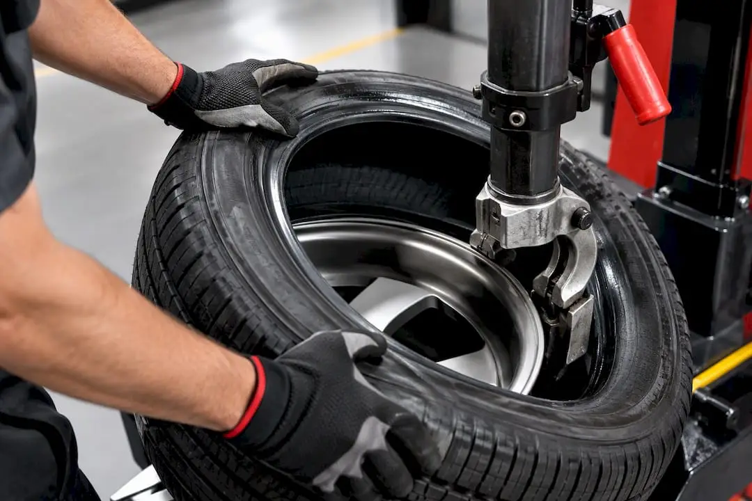 Technician demounting tire for internal inspection