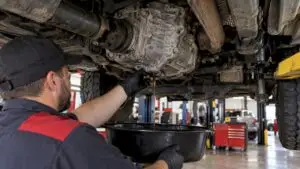 Technician servicing a truck transfer case